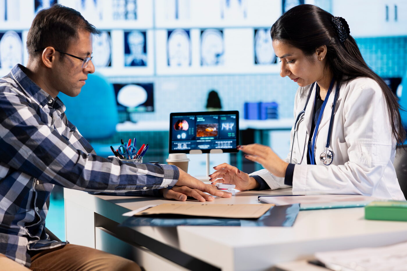 Healthcare professional checking patient oxygen levels